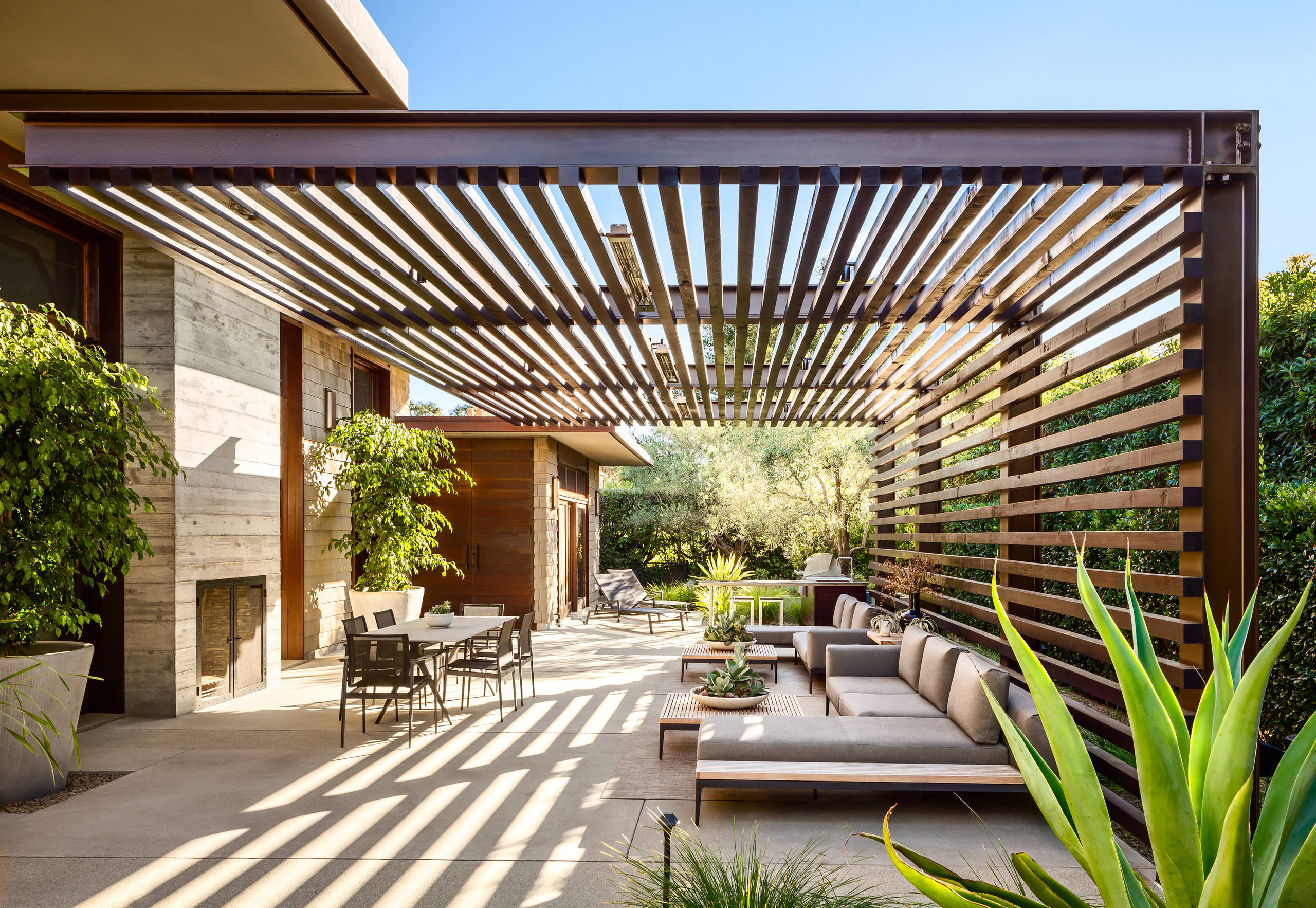 Elevated wooden deck overlooking landscaped backyard in West Island