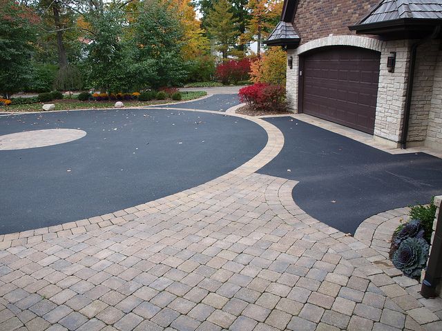 Freshly paved unistone driveway in a West Island residential landscaping project